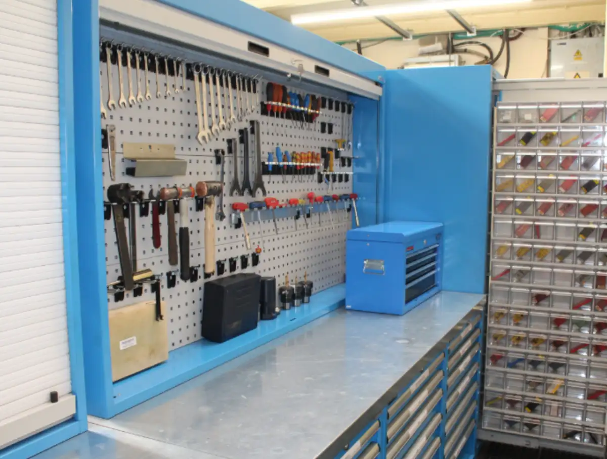 The Streamline Group consultant working with CNC machine operators on a production floor